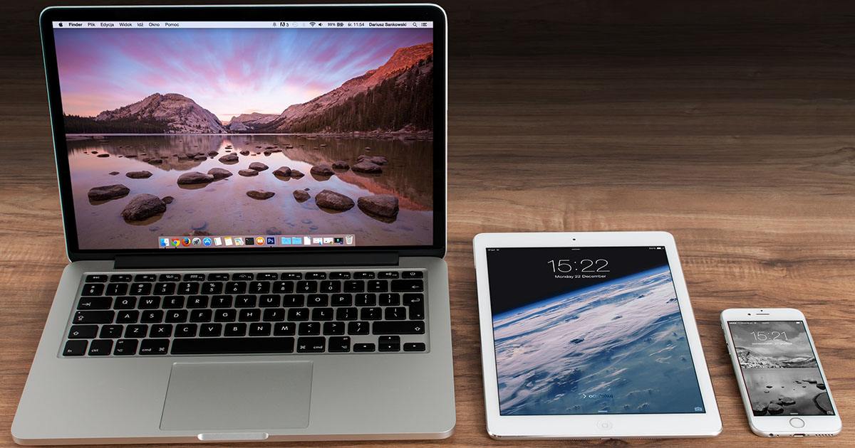 laptop, ipad, mobile phone laying next to each other