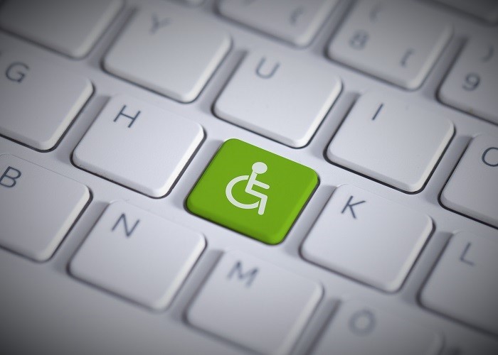 a keyboard with a green handicap key
