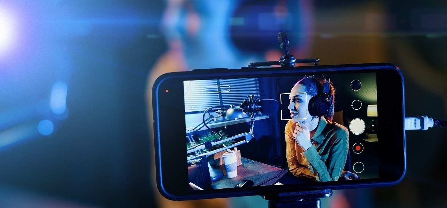 Young woman streaming a live video for Voiceover talent