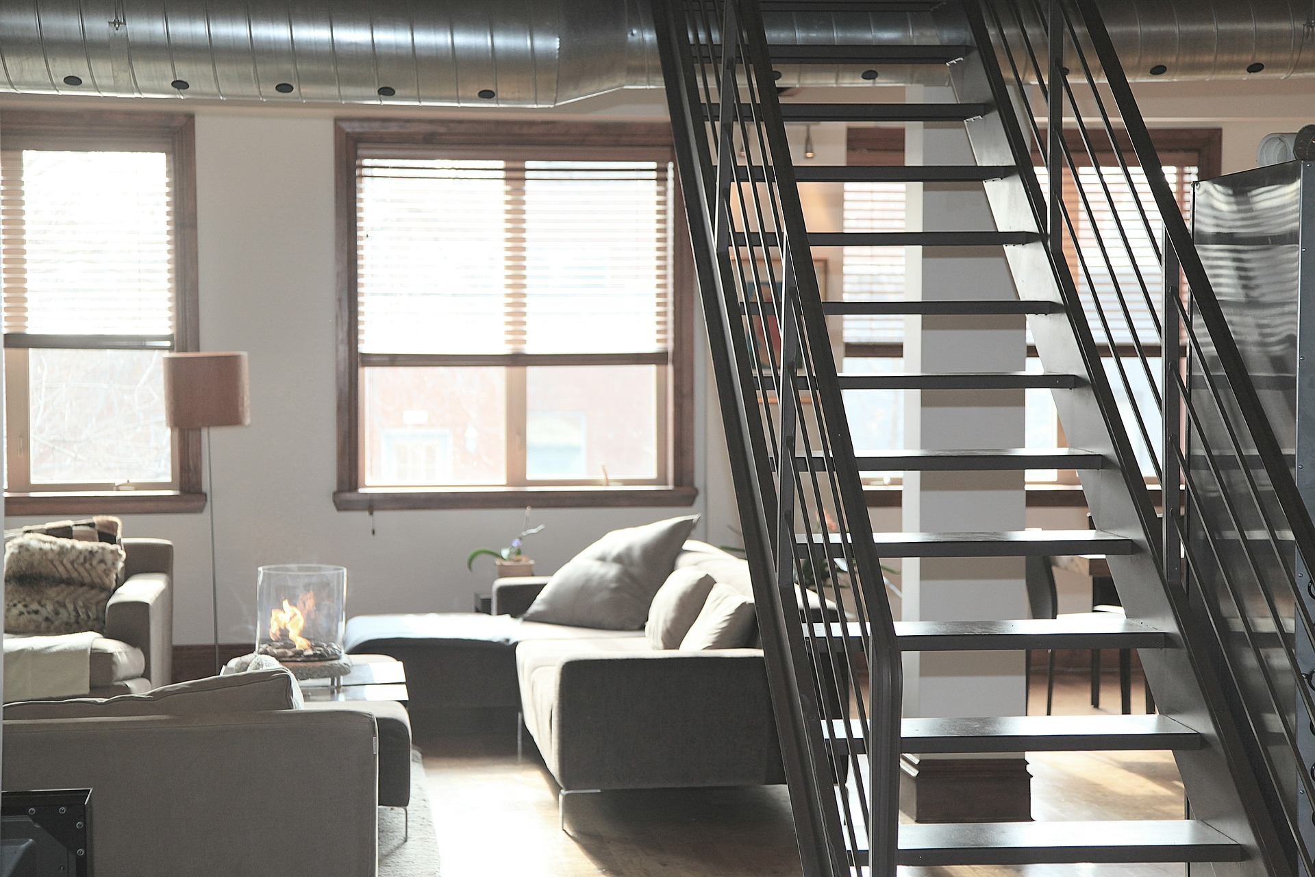 apartment living area with stairwell and couches