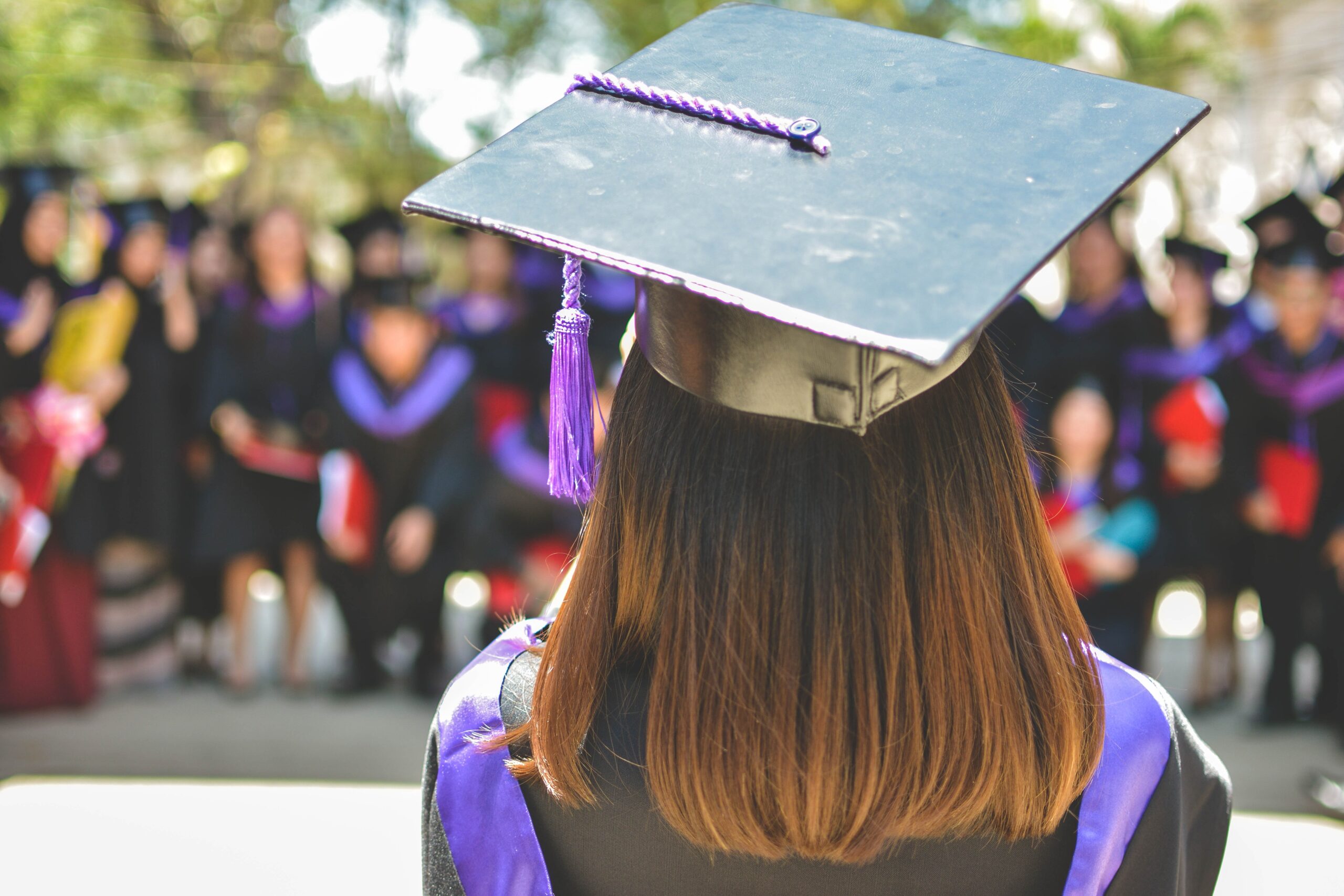 graduate giving speech from behind looking out to audience