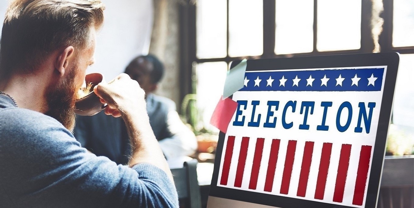 Man looking an Election image on computer