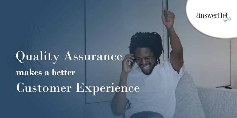 quality assurance - man on phone with smile and hand raised in excitement