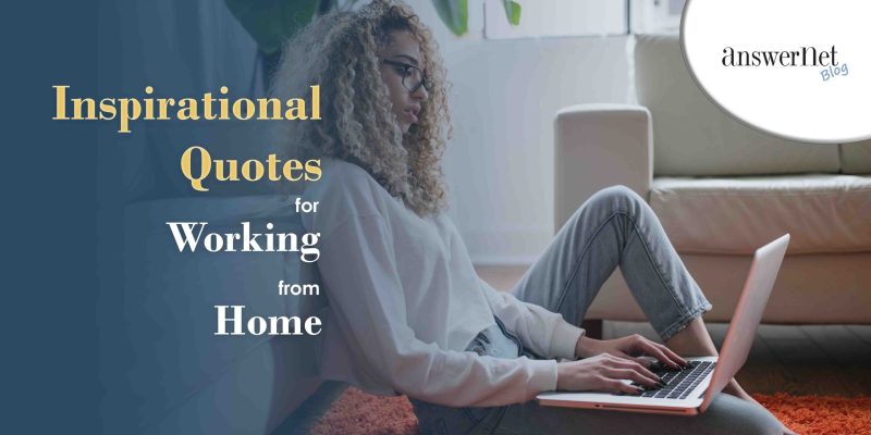 working from home - woman with thick curls sitting on floor with laptop